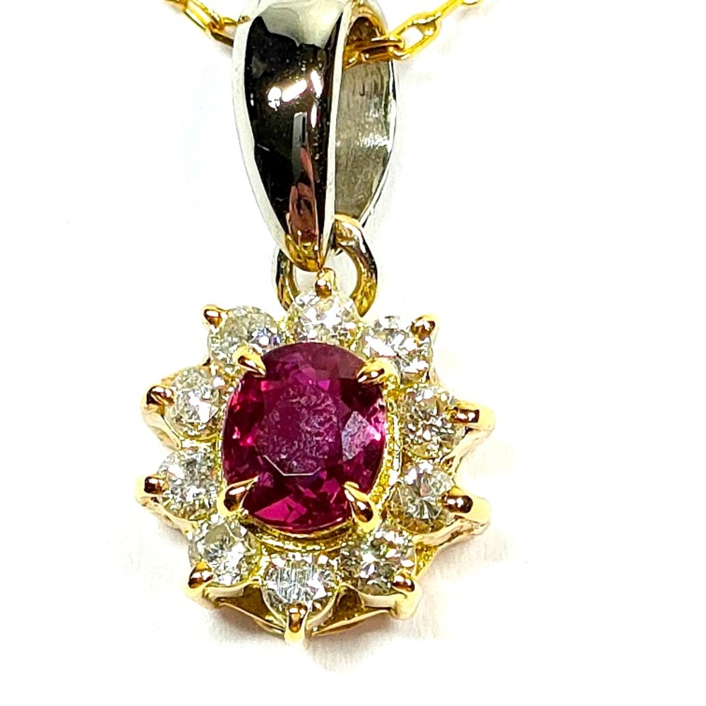 18K Ruby and Natural Diamonds the white metal that holds the pendant is platinum